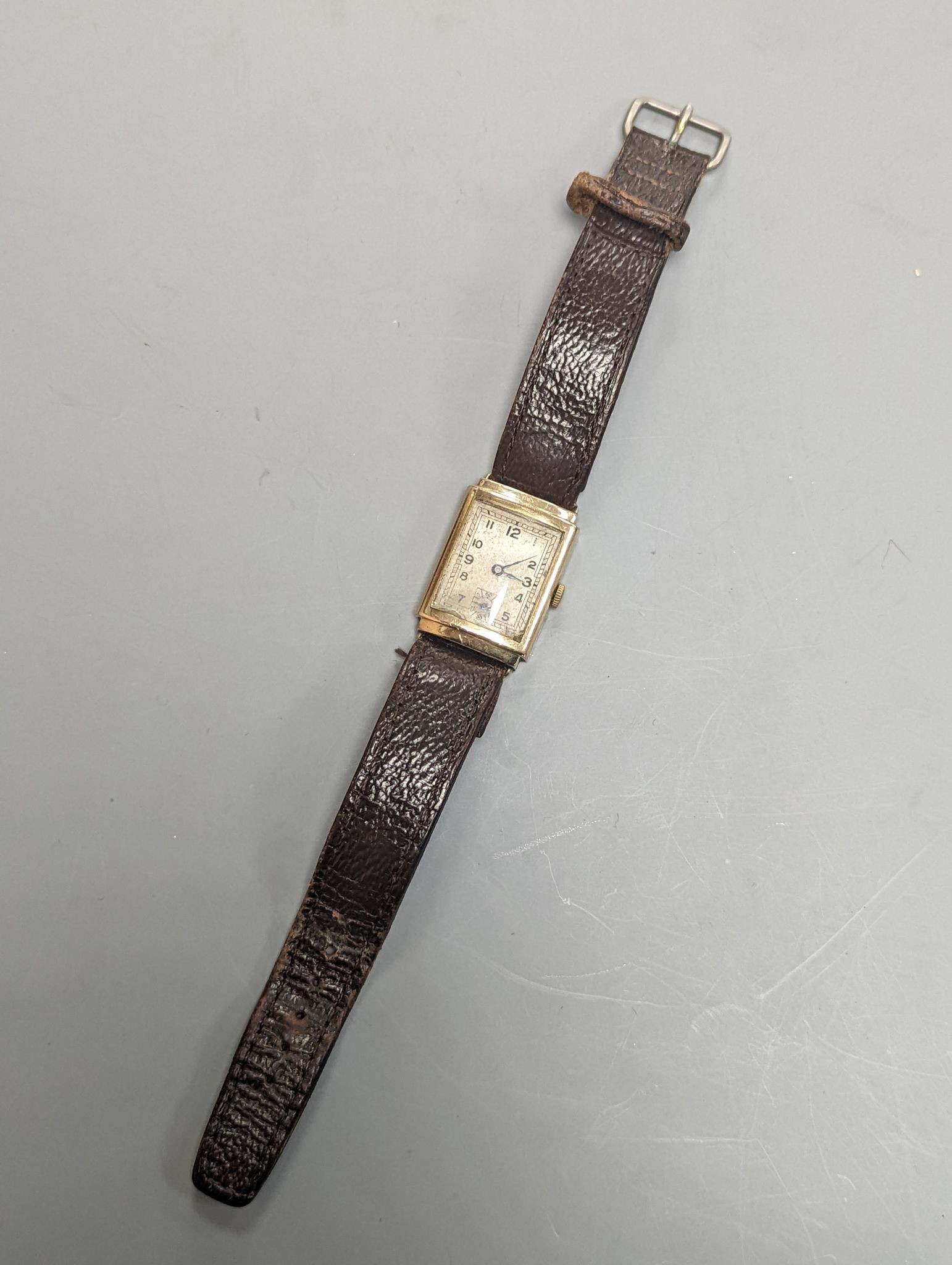 A gentleman's 1930's 9ct gold rectangular dial manual wind gold wrist watch.